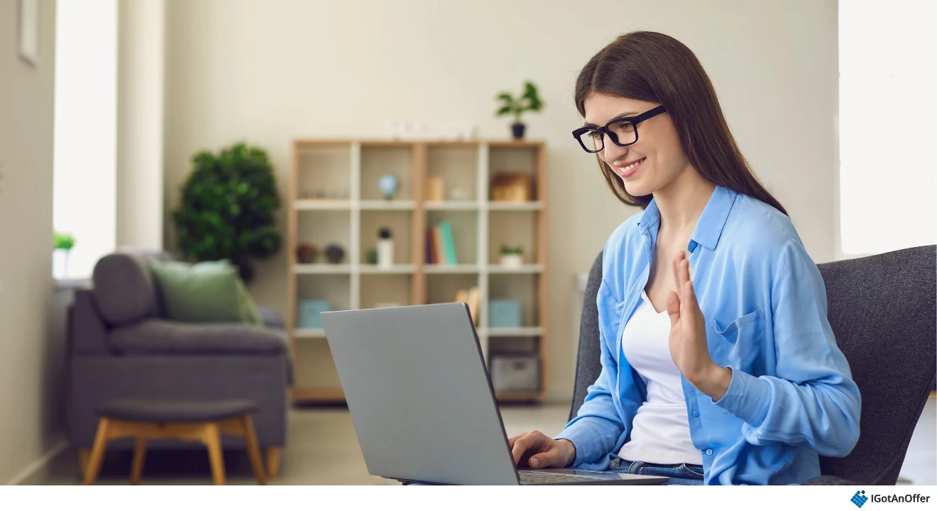 Woman practicing a virtual interview on her laptop from home