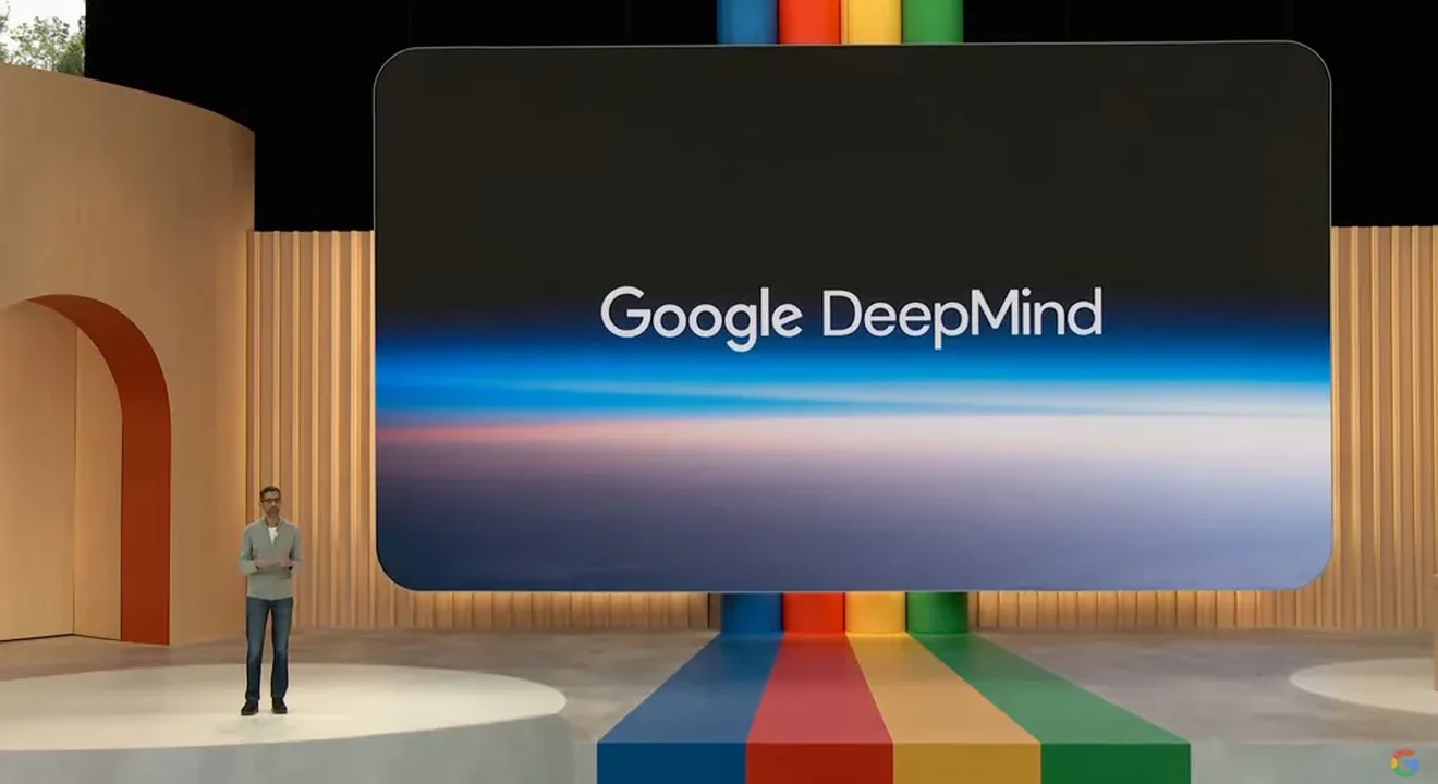 man presenting about google deepmind on stage