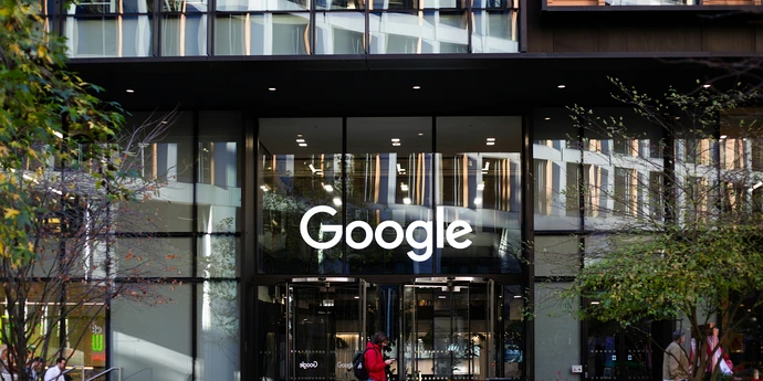 man standing in front of google building