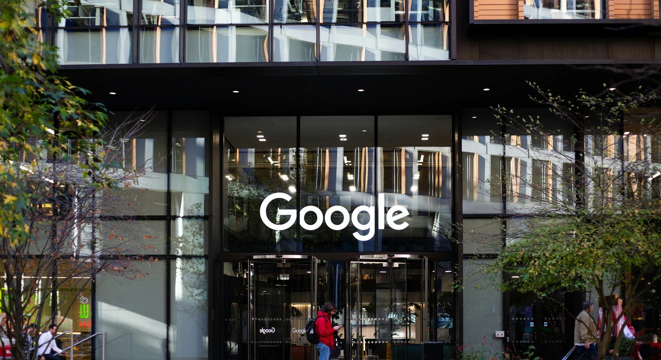 man standing in front of google building