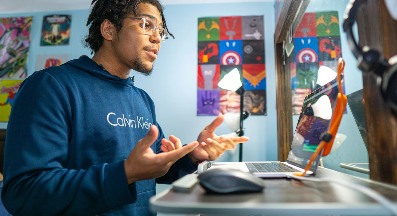 a young man preparing for a virtual product manager interview