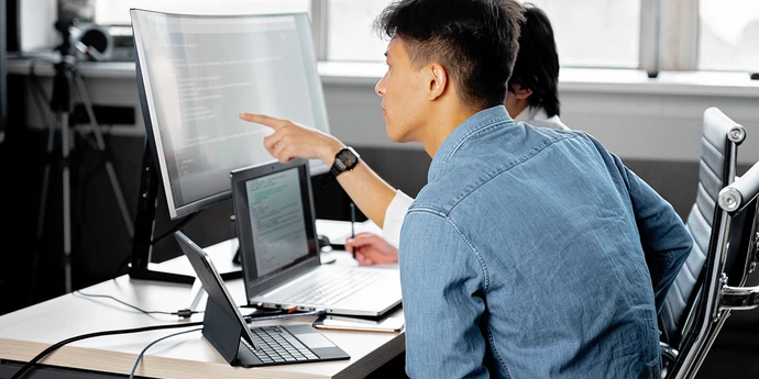 two Google L5 software engineers working together